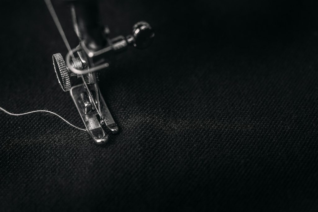 How Do You Safely Remove the Old Needle from the Sewing Machine?